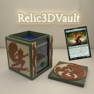 May include: A green and tan 3D-printed deck box for trading cards featuring a squirrel-themed relief on the side and a matching lid. The box displays a card titled The Unbeatable Squirrel Girl. A glowing sign above reads Relic3DVault.
