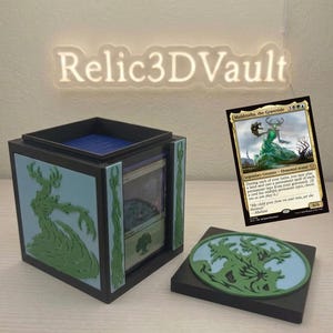 May include: A black and light blue deck box for trading cards featuring a green Muldrotha, the Gravetide creature emblem on the side and lid. The box contains a deck of cards and is displayed next to a Muldrotha, the Gravetide card.