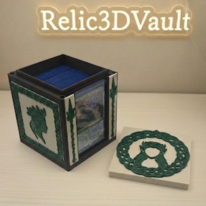May include: A black and green card storage box with a matching lid. The box features a green and white design with a woman's silhouette and spear-like accents. The text "Relic3DVault" is above the box.