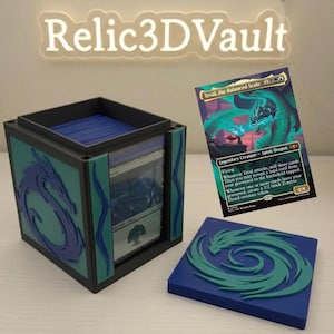 May include: A black and teal card storage box with a dragon design, a blue lid, and a card featuring a dragon. The box is labeled "Relic3DVault". The card shows a green dragon and the text "Teval, the Balanced Scale".