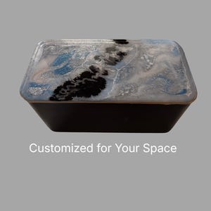 May include: A decorative, hexagonal box with a black base and a lid featuring a marbled design in shades of blue, silver, and black. The text "Customized for Your Space" is at the bottom.