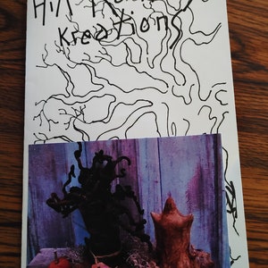 May include: A close-up of a handmade, rustic, brown, and black Halloween decoration. The decoration is a whimsical, spooky, and unique piece of art. The decoration is made of natural materials and has a rustic, vintage look. The decoration is perfect for adding a touch of Halloween charm to any home.