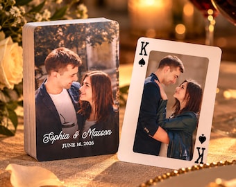May include: A deck of custom playing cards featuring a photograph of a couple, with the text Sophia & Masson and JUNE 16, 2026 printed on the front. One card is displayed upright, showing a King of Spades design with the same couple's photograph.