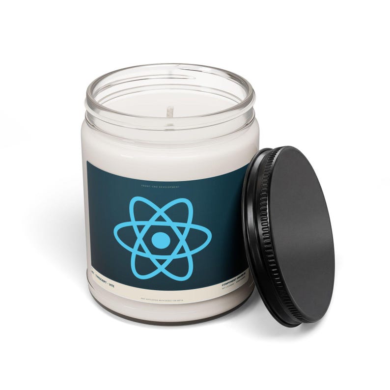React developer candle with the black lid off, showing white paraffin wax and cotton wick