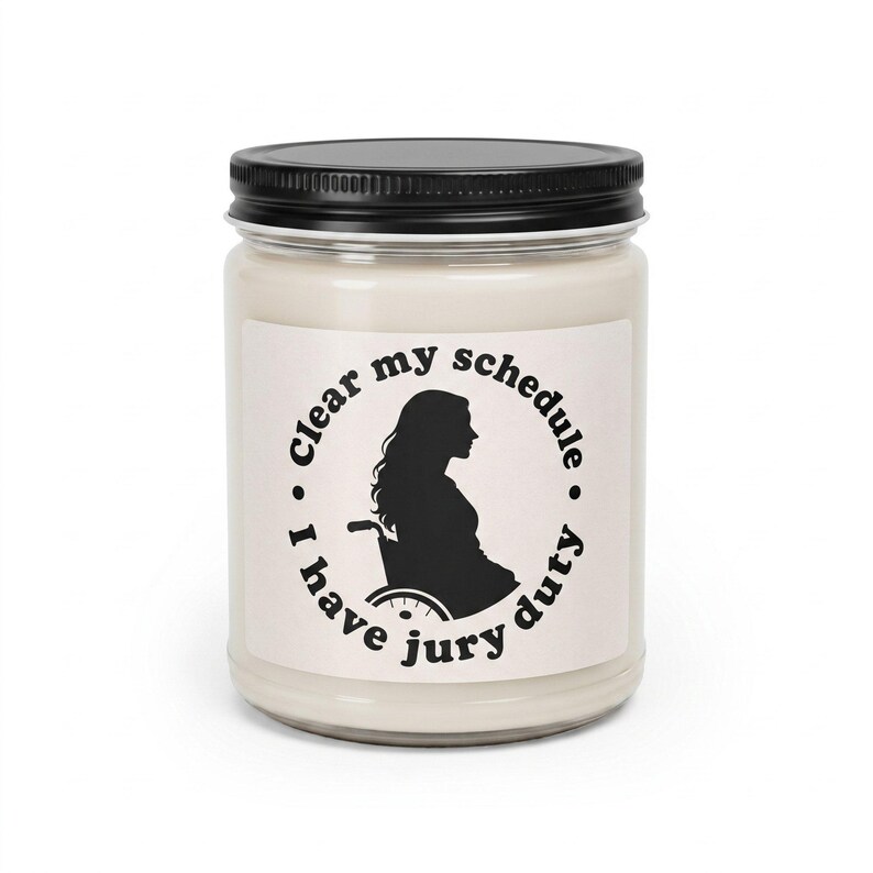 Lindsay Clancy candle, 12 oz paraffin candle in a glass jar with a black lid