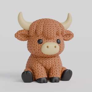 May include: A brown, knitted Highland cow figurine with black eyes and hooves, and cream-coloured horns and snout. The plush toy is sitting down, with its legs tucked in. The figurine has a cute, cartoonish design.