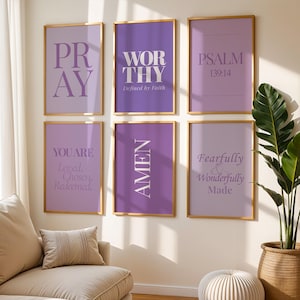 May include: A set of six rectangular wall art prints in gold frames, featuring various shades of purple backgrounds with white text including PRAY, WORTHY, PSALM 139:14, YOU ARE Loved, Chosen, Redeemed, AMEN, and Fearfully & Wonderfully Made.
