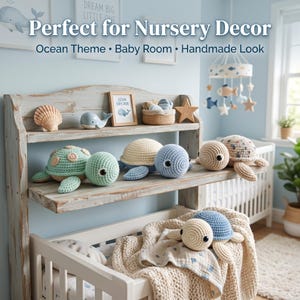 May include: A collection of crocheted sea turtle plush toys in shades of mint green, cream, and blue, displayed on a rustic wooden shelf. The scene includes a small whale figurine, a seashell, a star, and a soft blanket draped over a crib.