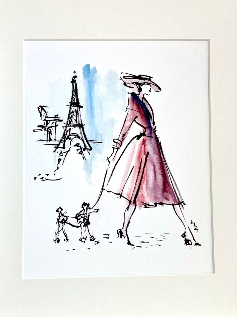 May include: A watercolour illustration of a woman in a red dress and hat walking a poodle in front of the Eiffel Tower.