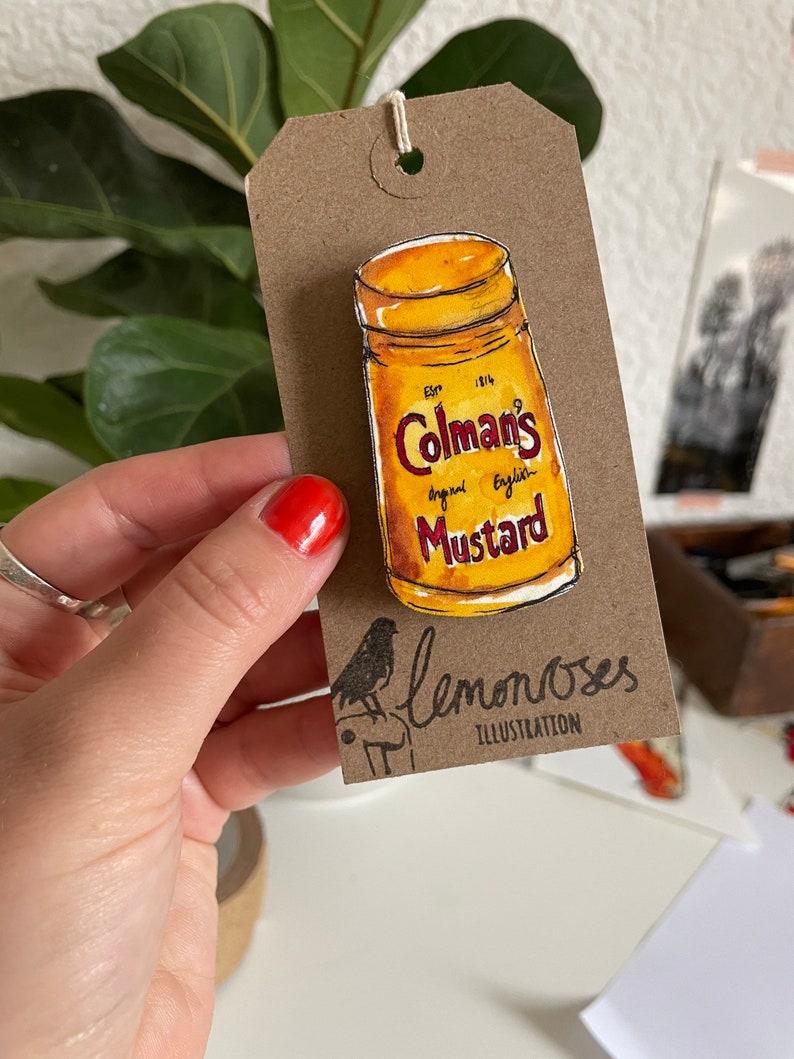 Coleman's mustard brooch image 1