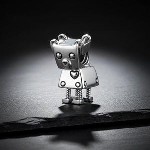 May include: A set of three ceramic mugs with a speckled, matte finish. The mugs are in shades of cream, light gray, and dark gray. Each mug has a simple, minimalist design and a rounded handle.