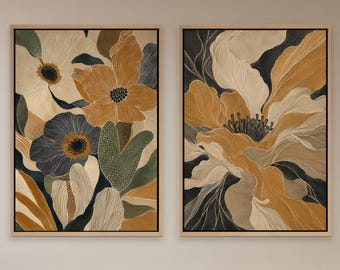 Puede incluir: Dos impresiones artísticas florales enmarcadas. La obra presenta flores estilizadas en tonos dorados, crema, azul marino y verde oliva. Los marcos son de color madera clara y las impresiones se exhiben en una pared de color neutro.