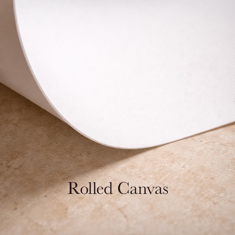 May include: A close-up of a rolled white canvas with a textured surface. The canvas is partially unrolled, revealing its edge against a light brown surface. The words "Rolled Canvas" are printed in brown.