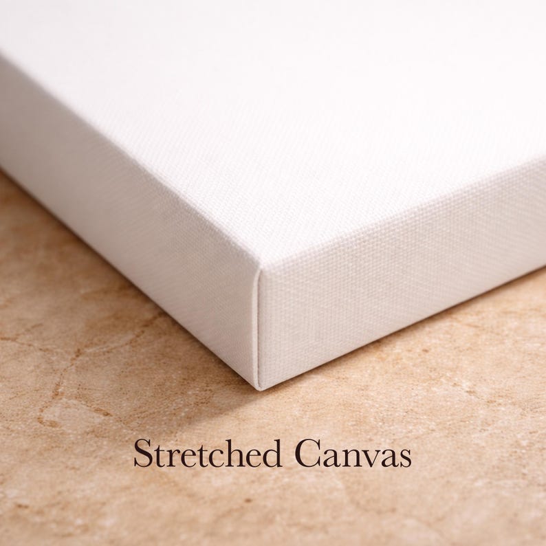 May include: Close-up of a white stretched canvas, showcasing the corner and edge. The canvas is tightly stretched over a wooden frame, with the text "Stretched Canvas" at the bottom.