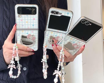 Karierte Stern Hello Kitty Handyhülle mit Band für Galaxy Z Flip 7, 6, 5, 4, 3