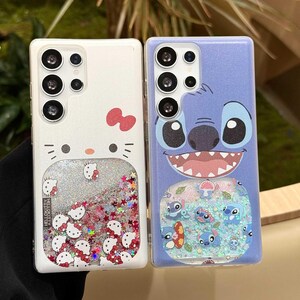 May include: Two phone cases: one white with a Hello Kitty design and a liquid glitter section, the other blue with a Stitch character design and a liquid glitter section. Both cases have multiple camera cutouts.