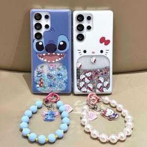 May include: Two phone cases with cartoon character designs, Stitch and Hello Kitty, and matching beaded bracelets. The Stitch case is blue, and the Hello Kitty case is white. The bracelets have character charms and pink heart-shaped tags.