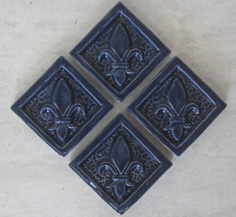 Ceramic Accent Tile Set Of 4 Fleur De Lis 2x2 Tiles In Navy Image 0