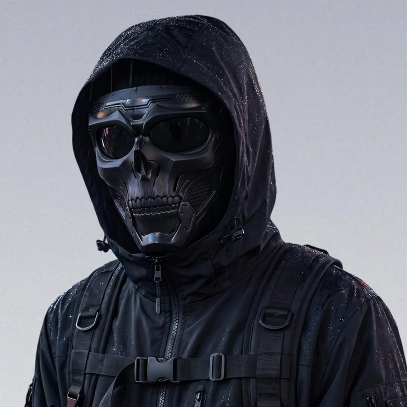 May include: A black skull mask with integrated goggles is worn over a black hooded jacket. The mask has a detailed skull design with eye sockets and a jaw. The jacket has a zipper, pockets, and a backpack. The overall aesthetic is dark and tactical.