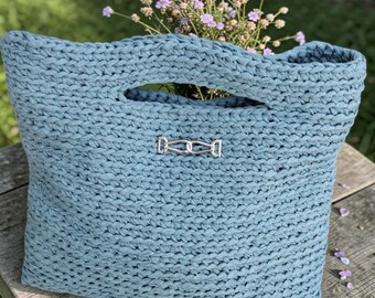 Handmade crocheted light blue tote bag with a beautiful buckle on the front and a magnetic closure.  33x34 cm/13x13 inches.