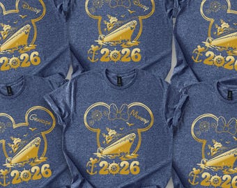 May include: Six navy blue t-shirts with a gold Mickey Mouse design, a cruise ship, and the year 2026. Each shirt has a different family member's name: Daddy, Disney, James, Grandpa, Mommy, and Grandma. The shirts are made of a soft material.