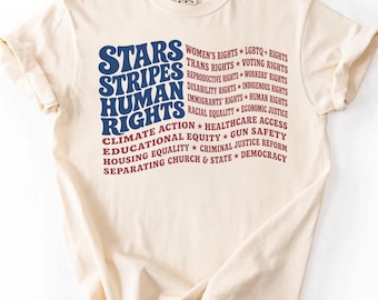 Camiseta con la bandera de Estados Unidos, barras y estrellas y derechos humanos, camiseta sutilmente anti-Trump, merchandising político, camiseta a favor de la inmigración, camiseta anti-ICE