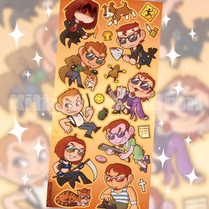 Op de afbeelding: Een stickervel met diverse chibi-stijl stripfiguren en iconen op een oranje achtergrond. De illustraties bevatten figuren met zonnebrillen, een hond, een kat, een granaat, een donut, een zeis, een schep en kleine tekstlabels.