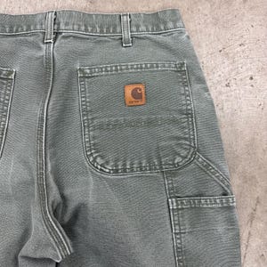 May include: A handmade wooden sign with the text "Welcome" in a playful font. The sign features a distressed white background and a dark brown border, perfect for a front door or entryway. Measures approximately 12 inches wide.