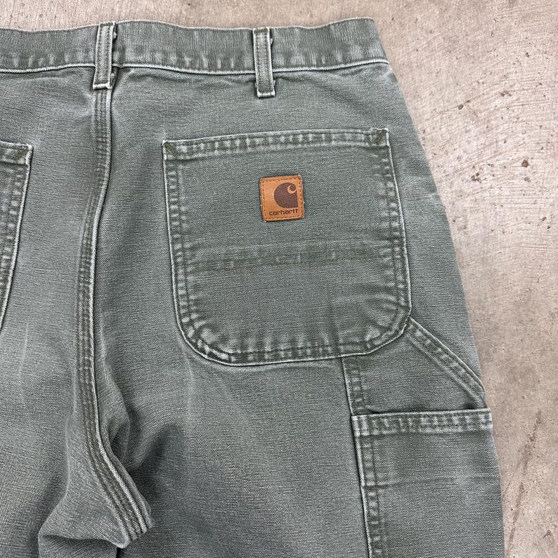 May include: A handmade wooden sign with the text "Welcome" in a playful font. The sign features a distressed white background and a dark brown border, perfect for a front door or entryway. Measures approximately 12 inches wide.