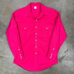 May include: A bright pink long-sleeve shirt with a button-down front, two chest pockets, and buttoned cuffs. The shirt has a classic collar and white pearlized buttons. The fabric appears to be a solid color, with a smooth texture.