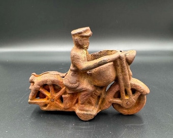 Vintage cast iron policeman motorcycle