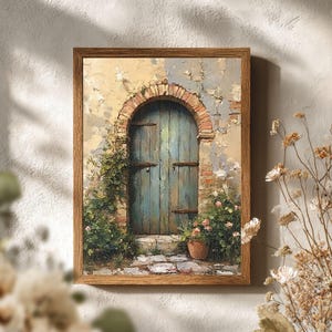 May include: A framed painting depicts a weathered blue door set within a brick archway. The artwork features a rustic aesthetic with a muted color palette, including beige, blue, and brown tones. Green foliage and potted flowers add a touch of nature.