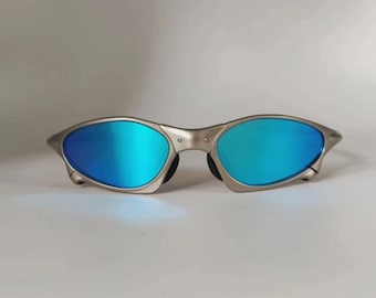 Lunettes de soleil Oakley Penny & Juliet X-Mental Monture argentée Verres bleu clair