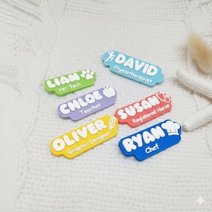 May include: A collection of colorful name tags with professions printed on them. The tags include names like Liam, Chloe, David, Oliver, Susan, and Ryan, with their respective titles such as Vet Tech, Teacher, Physiotherapist, Graphic Designer, Registered Nurse, and Chef.