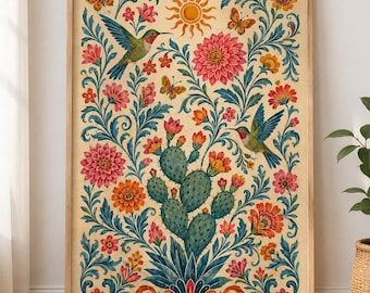 May include: A framed vertical wall art print featuring a central green prickly pear cactus surrounded by symmetrical floral patterns, two hummingbirds, three butterflies, and a sun icon in a warm color palette of pink, orange, and blue.