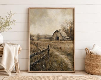 May include: A framed wall art print depicting a rural landscape with a weathered wooden barn situated in a dry, grassy field. A rustic split-rail fence runs along a dirt path leading toward the barn under a muted, overcast, cloudy sky.