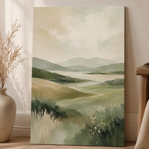 May include: A rectangular canvas print featuring a landscape painting of rolling hills, distant mountains, and a central body of water. The colour palette consists of muted sage green, olive, cream, and soft beige tones with a painterly texture.