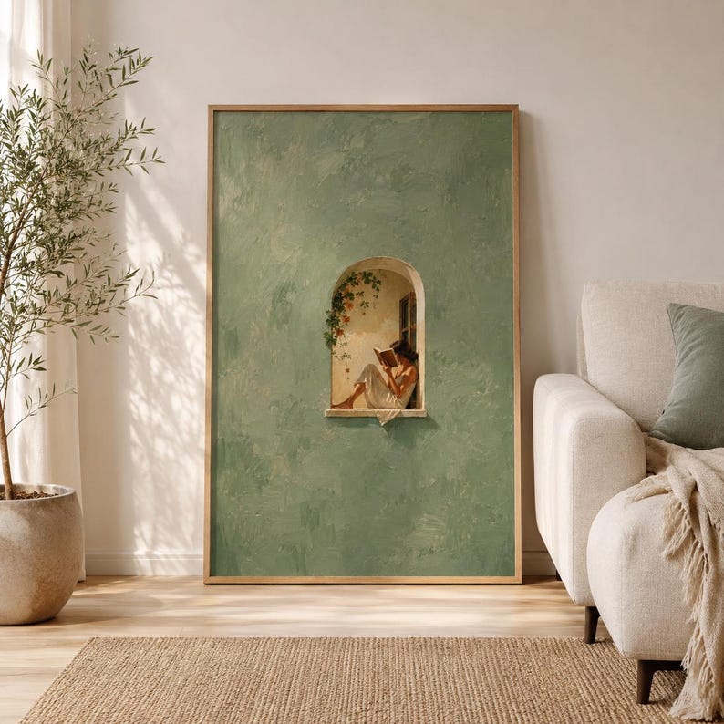 May include: A vertical rectangular wall art print featuring a textured sage green background with a central arched window cutout. Inside the window, a figure in a white dress sits reading a book, surrounded by climbing green vines and flowers.