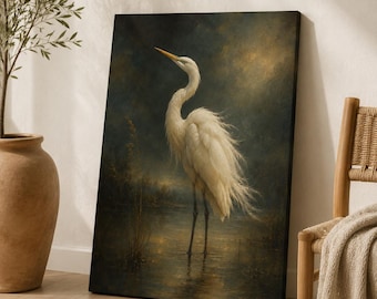May include: A rectangular canvas wall art print featuring a white egret standing in shallow water. The bird has long, flowing white feathers and a yellow beak. The background is a dark, moody landscape with golden light reflecting on the water.