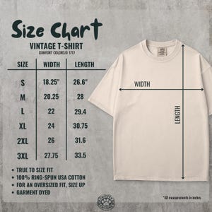 May include: A cream-colored vintage t-shirt with a size chart. The chart lists sizes S to 3XL, with width and length measurements in inches. The shirt is made of 100% ring-spun USA cotton and is garment dyed. The text on the chart reads "Size Chart" and "Vintage T-Shirt".