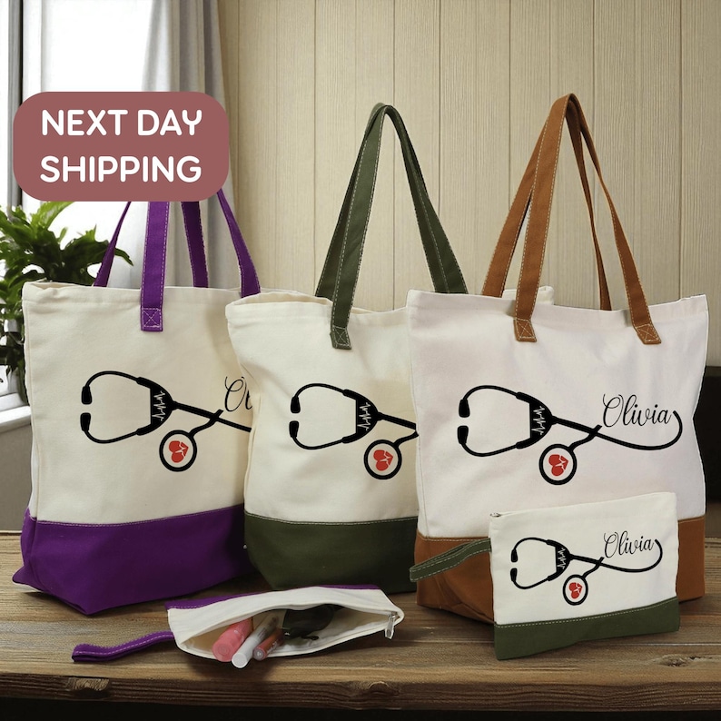a collection of tote bags and a small pouch, each with a unique design featuring a stethoscope and a heart symbol. The bags are arranged on a wooden surface, and there is a sign indicating "Next day shipping" in the top left corner.