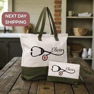 A white tote bag with a stethoscope design and the name "Olivia" printed on it, along with a smaller white bag with the same design and name printed on it, both placed on a wooden surface.