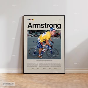 Puede incluir: Un póster enmarcado que muestra a un ciclista con un maillot amarillo y pantalones cortos azules, montando en una bicicleta azul. El póster tiene el nombre "Armstrong" en letras negras grandes. El póster incluye el texto "Cometí errores y aprendí de todos."