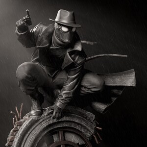 May include: A black and white statue of a character in a fedora, goggles, and trench coat, holding a gun. The figure is crouched on a weathered, circular structure, with rain falling in the background. The statue has a vintage, noir aesthetic.