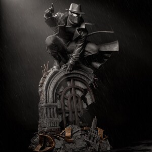 May include: A black and white statue of a character in a fedora, trench coat, and mask, holding a gun. The figure is crouched on a crumbling stone structure, with rain falling in the background. The statue has a vintage, noir aesthetic.