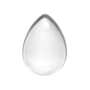 May include: A clear, teardrop-shaped makeup sponge. The sponge has a rounded bottom and a pointed top. The surface of the sponge has a textured appearance. The background is plain white.