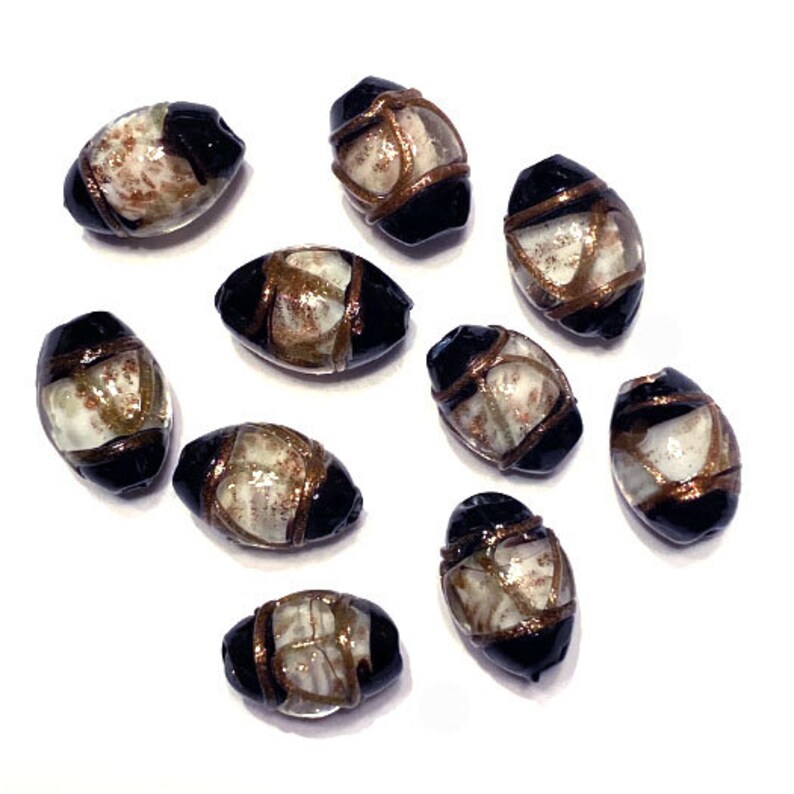 18 x 12mm Glass Lampwork Beads B/'sue Boutiques 10 Pieces Item04604 Transparent Clear and White Middle With Gold Swirls and Black Ends
