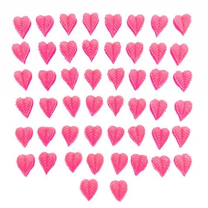 May include: A sheet of 64 pink heart-shaped stickers with a leaf design.