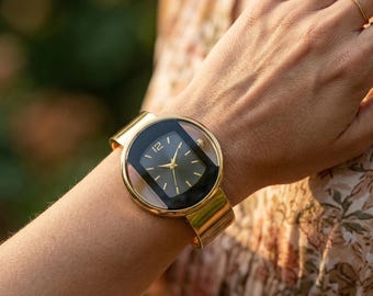 Reloj brazalete tipo brazalete de oro / Reloj de pulsera minimalista de acero inoxidable para mujer