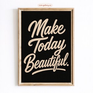 May include: A rectangular wall art print in a light wood frame featuring a black background with the text "Make Today Beautiful" written in a large, beige, cursive script font. The design is centered within the frame, creating a high-contrast look.